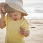 cute little boy playing on the beach